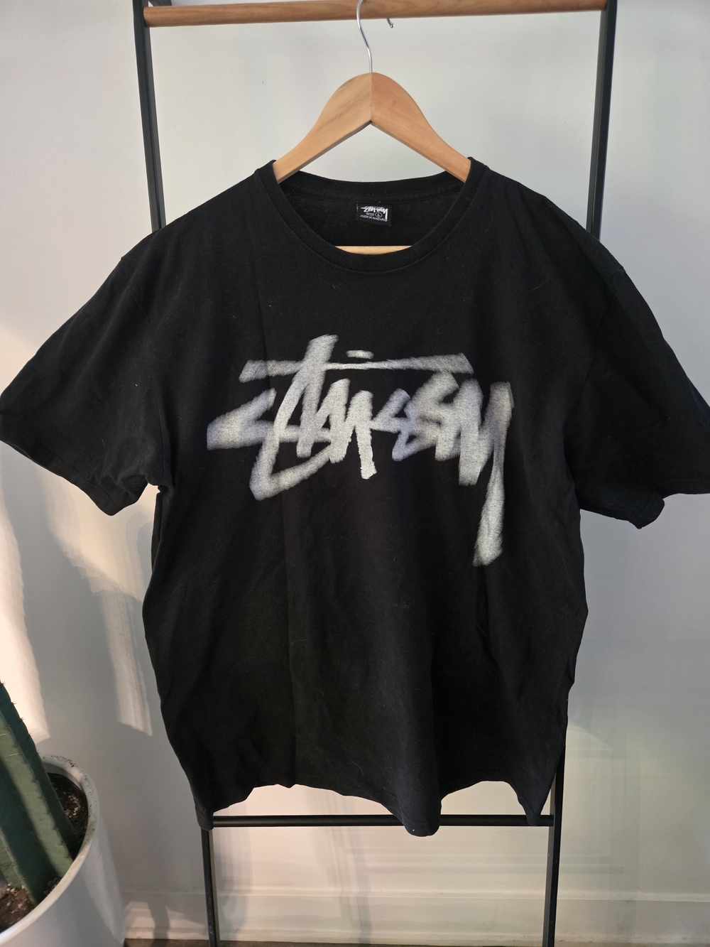 Stussy Black T-Shirt with White Spray Logo